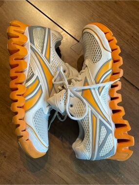 Reebok Men’s White and Orange Wave-sole Sneakers